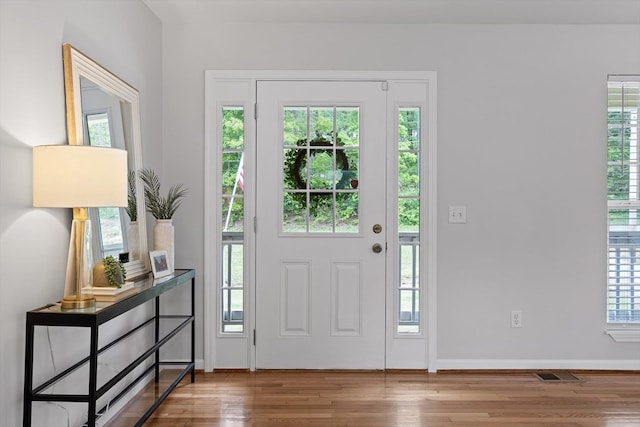 5742 Keith Rd, Ringgold, GA 30736 - foyer entrance with baseboards, wood finished floors, and visible vents
