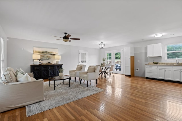 5742 Keith Rd, Ringgold, GA 30736 - living room with ceiling fan, a wealth of natural light, and light wood-style floors