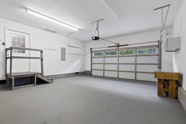 5742 Keith Rd, Ringgold, GA 30736 - garage featuring a garage door opener and electric panel