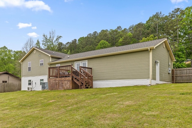 5742 Keith Rd, Ringgold, GA 30736 - back of property featuring a lawn, fence, a wooden deck, and central air condition unit