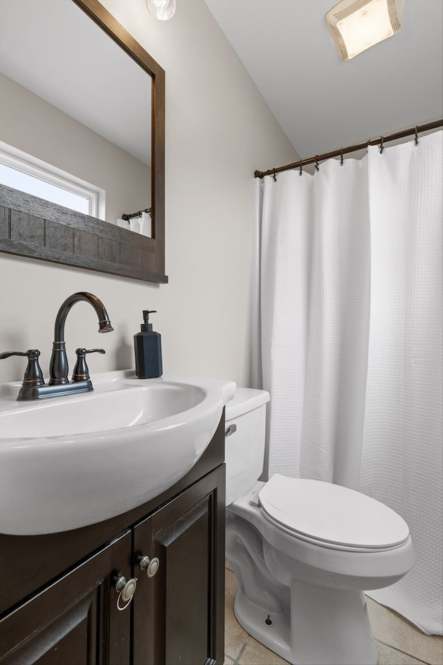 5742 Keith Rd, Ringgold, GA 30736 - full bath featuring toilet, vaulted ceiling, tile patterned flooring, and vanity