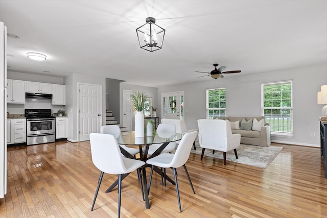 5742 Keith Rd, Ringgold, GA 30736 - dining room with a ceiling fan, baseboards, stairway, and light wood-type flooring