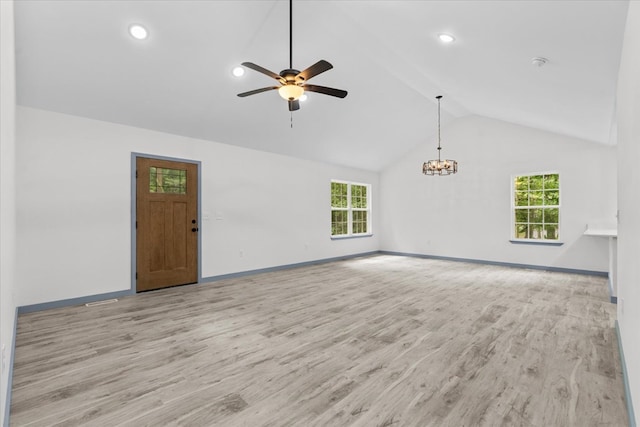409 Van Buren Dr, Dalton, GA 30721 - unfurnished living room with wood finished floors, plenty of natural light, a ceiling fan, a chandelier, and recessed lighting