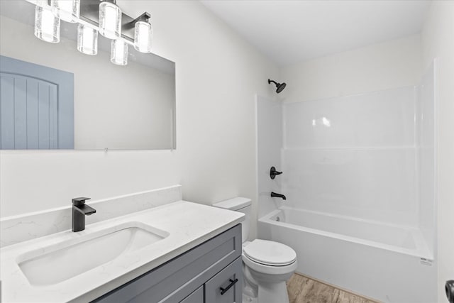 409 Van Buren Dr, Dalton, GA 30721 - full bathroom featuring vanity, wood finished floors, and  shower combination