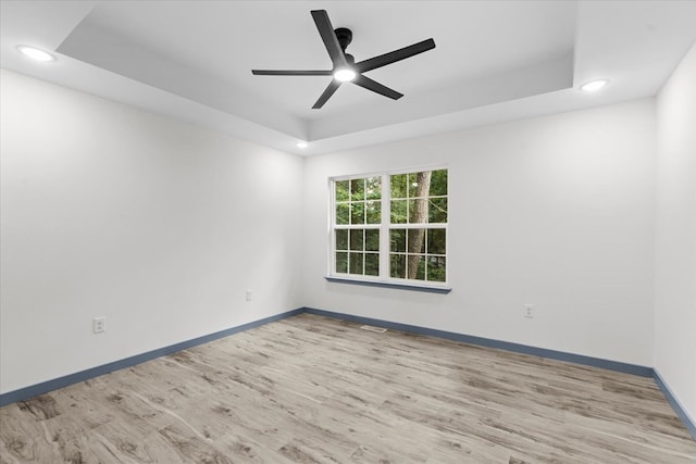 409 Van Buren Dr, Dalton, GA 30721 - spare room featuring a tray ceiling, a ceiling fan, wood finished floors, and recessed lighting