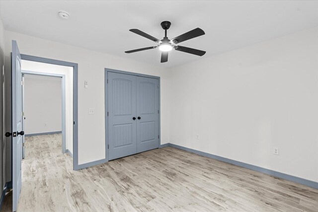 409 Van Buren Dr, Dalton, GA 30721 - unfurnished bedroom featuring light wood-type flooring, a closet, and ceiling fan