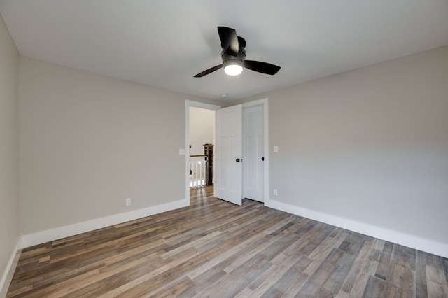 spare room with ceiling fan and hardwood / wood-style floors