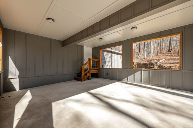 unfurnished bedroom featuring unfinished concrete flooring