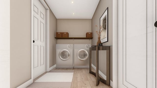 washroom with separate washer and dryer and light wood-type flooring