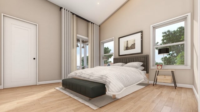 bedroom with multiple windows and light hardwood / wood-style flooring