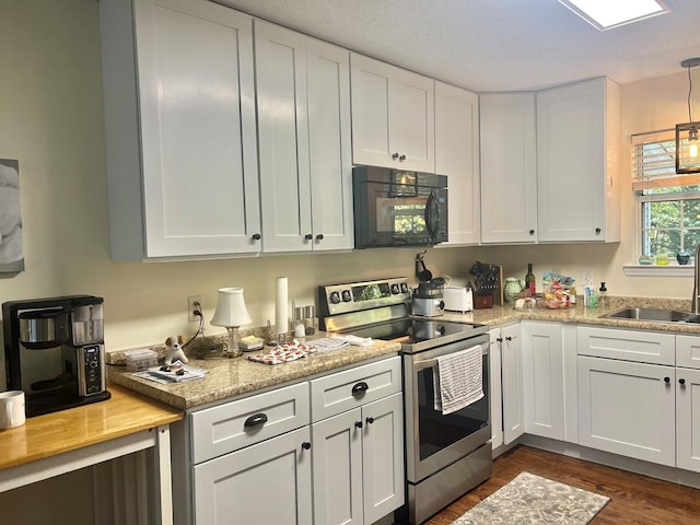 kitchen featuring electric stove, sink, dark hardwood / wood-style flooring, and white cabinets