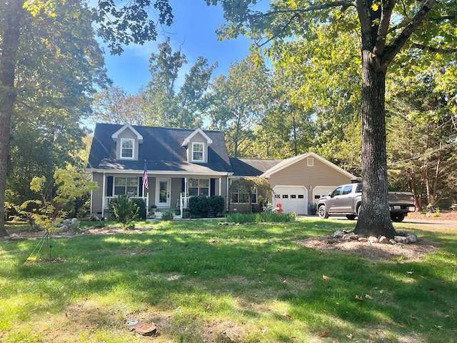 cape cod-style house with a garage, covered porch, and a front lawn