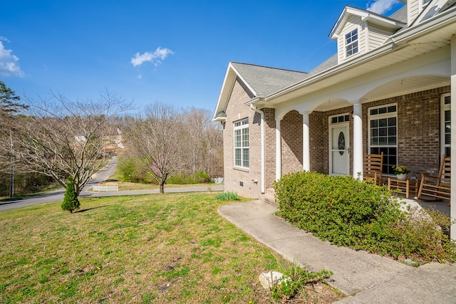 3034 Highland Cir, Rocky Face, GA 30740 - view of exterior entry with brick siding, covered porch, and a yard