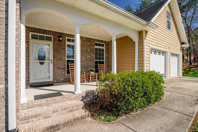 3034 Highland Cir, Rocky Face, GA 30740 - entrance to property featuring roof with shingles, covered porch, a garage, and concrete driveway