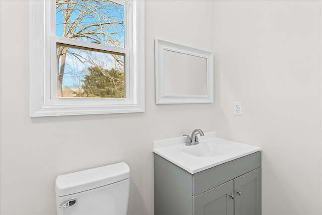 bathroom with vanity and toilet