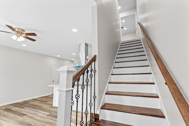 staircase featuring recessed lighting, baseboards, wood finished floors, and a ceiling fan