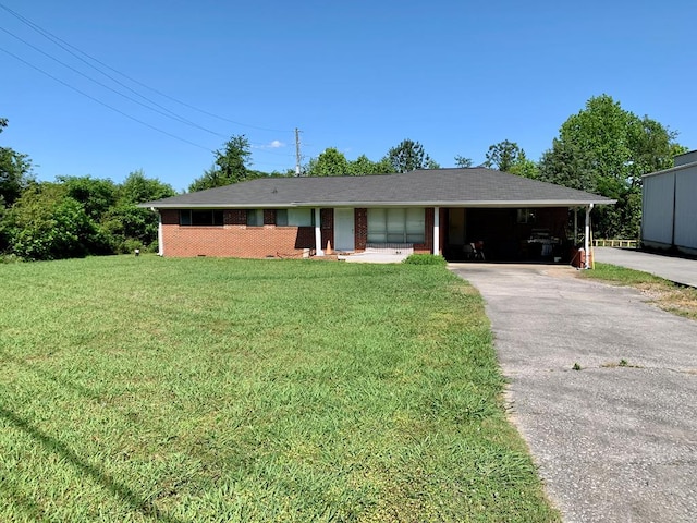 3281 Dug Gap Rd, Dalton, GA 30720 - ranch-style home with a front yard, driveway, and an attached carport
