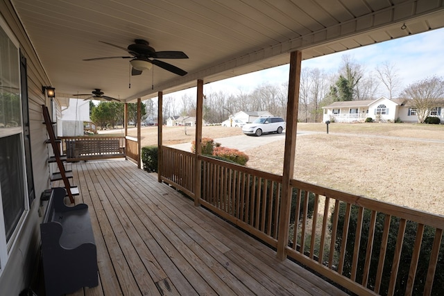 wooden deck featuring ceiling fan and covered porch