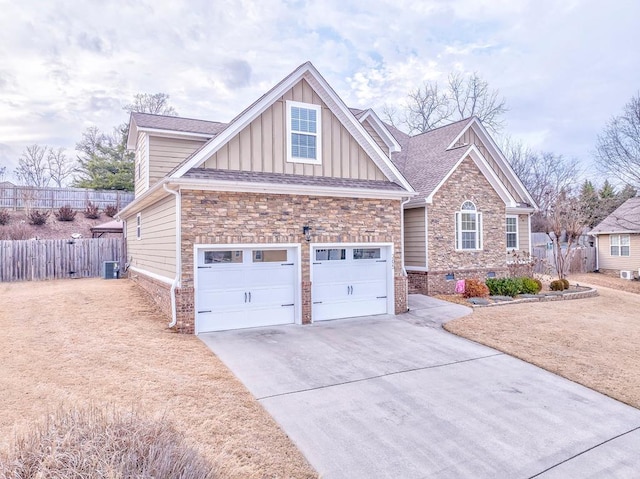 view of front of home with cooling unit and a garage