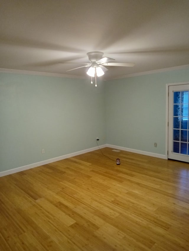 unfurnished room featuring crown molding, ceiling fan, and light wood-type flooring