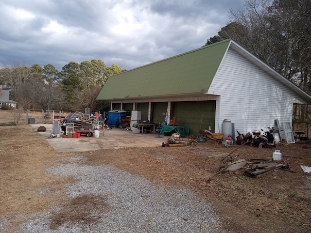 view of home's exterior featuring an outbuilding and a garage