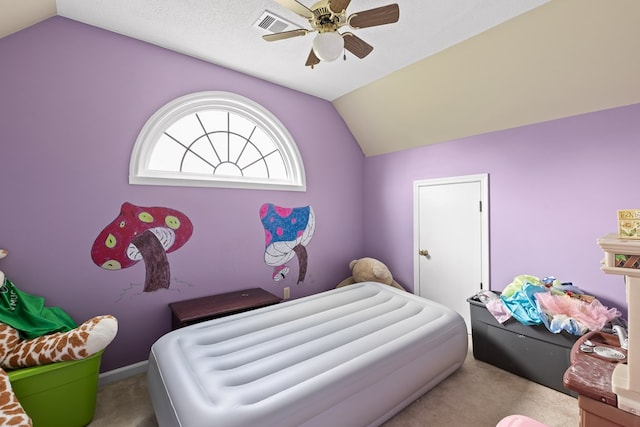 bedroom with ceiling fan, lofted ceiling, carpet, and a textured ceiling