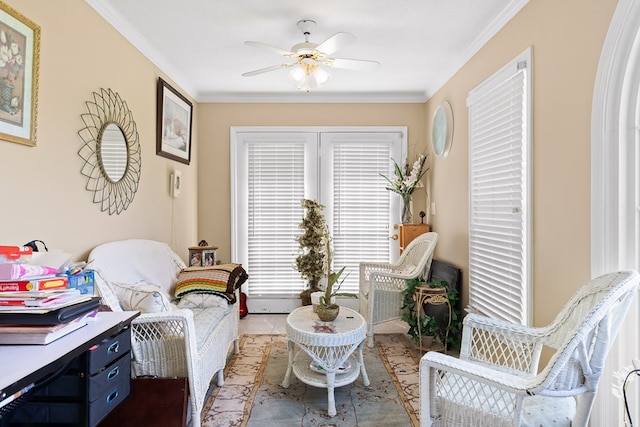 sitting room with crown molding and ceiling fan