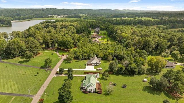 birds eye view of property featuring a water view and a rural view