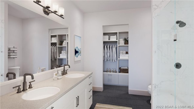 bathroom featuring toilet, a shower, and vanity