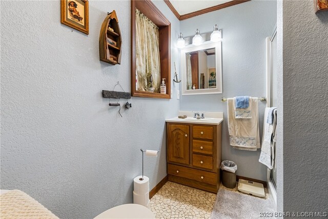 bathroom featuring vanity and crown molding