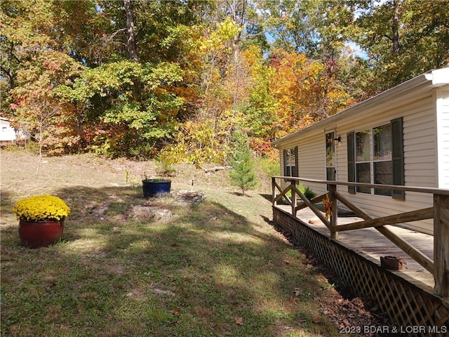 view of yard featuring a wooden deck