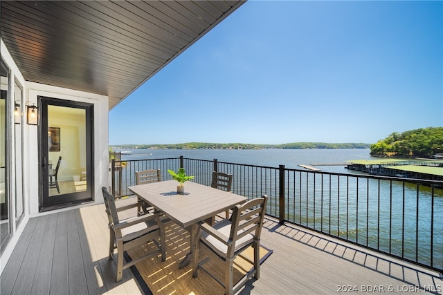 wooden deck with a water view