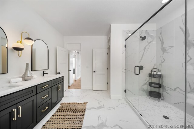 bathroom with an enclosed shower, hardwood / wood-style flooring, and double sink vanity