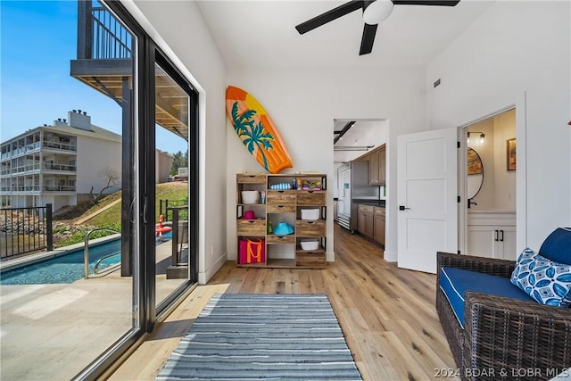 interior space featuring light wood-type flooring and ceiling fan