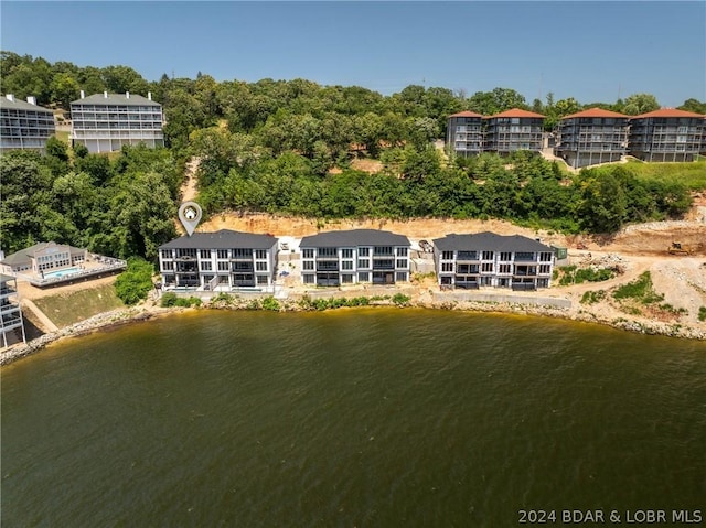 birds eye view of property with a water view