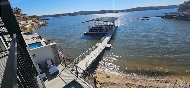 dock area with a water view