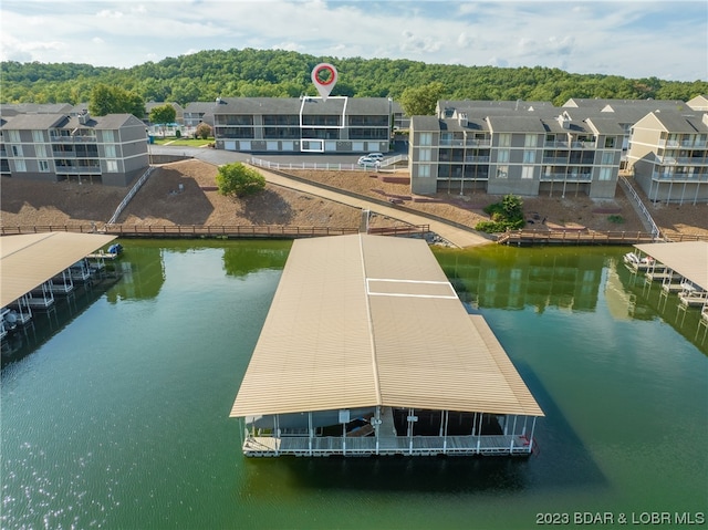 exterior space with a balcony and a water view