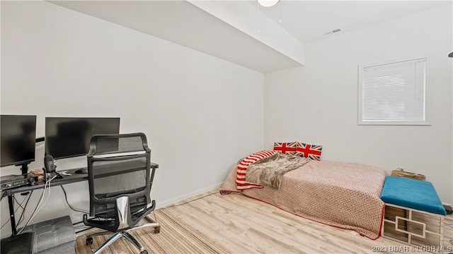 bedroom featuring wood-type flooring