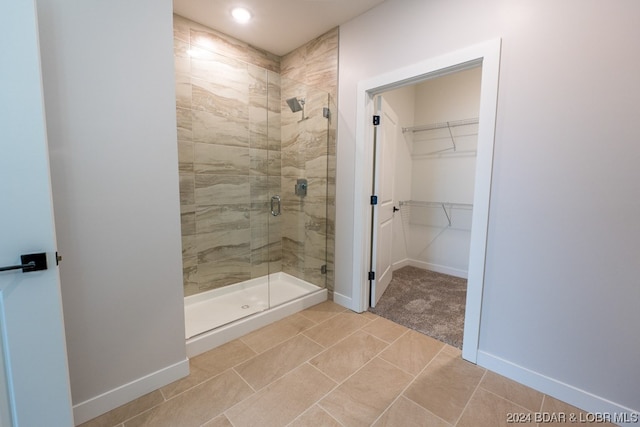 bathroom featuring tile patterned flooring and walk in shower