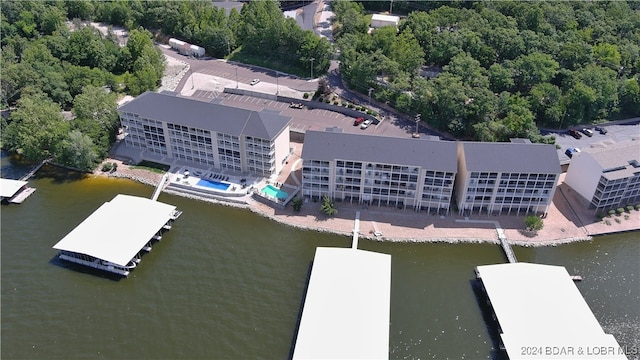 birds eye view of property with a water view