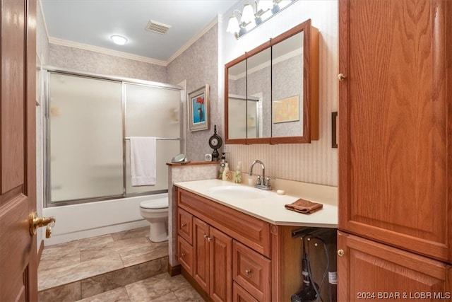 full bathroom with tile flooring, shower / bath combination with glass door, large vanity, toilet, and ornamental molding