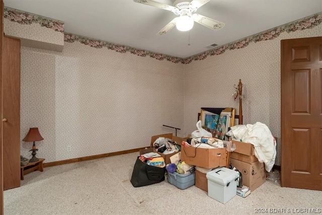 miscellaneous room featuring light colored carpet and ceiling fan