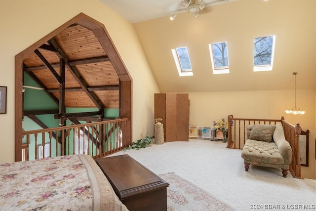 carpeted bedroom featuring wood ceiling, a skylight, a notable chandelier, high vaulted ceiling, and beam ceiling