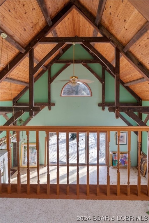 interior space featuring wooden ceiling, carpet floors, and beamed ceiling