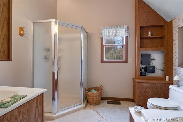 bathroom with lofted ceiling, walk in shower, toilet, and vanity