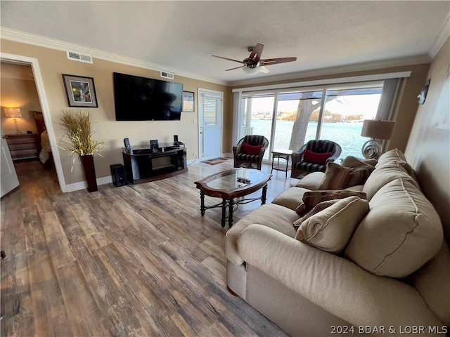 living room featuring ornamental molding, ceiling fan, and hardwood / wood-style flooring