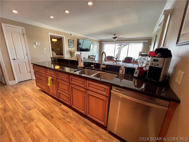 kitchen featuring stainless steel dishwasher, dark stone countertops, ceiling fan, ornamental molding, and sink