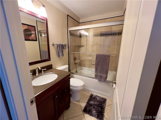 full bathroom featuring toilet, tile patterned floors, bath / shower combo with glass door, vanity, and crown molding