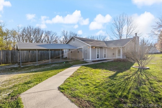 view of front of house featuring a front yard and a carport