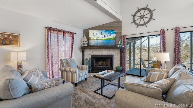 living room featuring a stone fireplace, vaulted ceiling, light wood-type flooring, and wooden walls